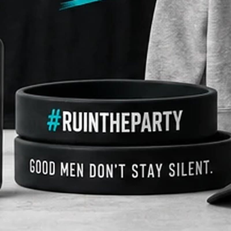 Two black silicone wristbands, one reading #RuinTheParty and one reading Good men don't stay silent